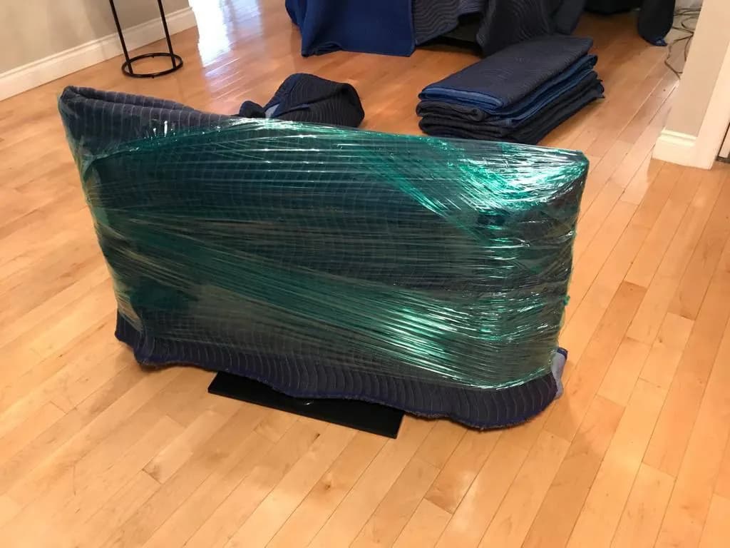 Furniture secured with protective moving blankets